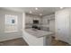 Modern kitchen with granite countertops and stainless steel appliances at 510 Fife Ct, Gibsonville, NC 27249