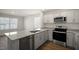 Modern kitchen with granite countertops and stainless steel appliances at 510 Fife Ct, Gibsonville, NC 27249