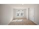 Well-lit bedroom with carpet and window at 511 Fife Ct., Gibsonville, NC 27249