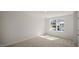 Spacious bedroom with carpeted floors and large window at 511 Fife Ct., Gibsonville, NC 27249
