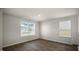 Bright dining area with large windows and wood-look floors at 511 Fife Ct., Gibsonville, NC 27249