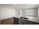Kitchen boasts a granite island with a double sink and modern appliances at 511 Fife Ct., Gibsonville, NC 27249