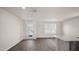 Spacious living room with wood-look floors and patio access at 511 Fife Ct., Gibsonville, NC 27249