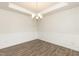 Formal dining room with hardwood floors and chandelier at 590 Glenkirk Pl, Garner, NC 27529