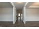 Bright hallway with hardwood floors leading to other rooms at 590 Glenkirk Pl, Garner, NC 27529