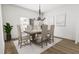 Elegant dining area with a chandelier and large windows at 704 Portia Way, Homesite 15, Morrisville, NC 27560