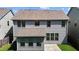 Rear view of two-story house with gray siding at 1022 Laredo Ln, Durham, NC 27703