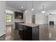 Spacious kitchen featuring an island, stainless steel appliances, and dark wood cabinets at 1022 Laredo Ln, Durham, NC 27703