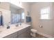Bathroom with vanity, toilet, shower, and updated fixtures at 104 Newport Landing Lndg # 100, Garner, NC 27529
