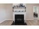 Fireplace with decorative mantel and neutral tones at 104 Newport Landing Lndg # 100, Garner, NC 27529