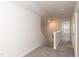 Upstairs hallway with carpeted floor and access to bedrooms at 104 Newport Landing Lndg # 100, Garner, NC 27529
