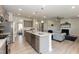 Modern kitchen with gray cabinets, granite counters, stainless steel appliances, and an island at 104 Newport Landing Lndg # 100, Garner, NC 27529