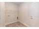 Laundry room with built-in shelving and modern flooring at 104 Newport Landing Lndg # 100, Garner, NC 27529