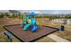 playground with a slide and climbing structures at 104 Newport Landing Lndg # 100, Garner, NC 27529
