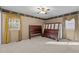 Bedroom with wood bed frame and neutral colored walls at 112 Collums Rd, Chapel Hill, NC 27514