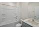 Clean bathroom with white tub surround, gray vanity, and quartz countertop at 1128 Middlecrest Dr, Rocky Mount, NC 27804