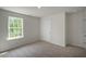 Simple bedroom with window and carpeted floor at 1128 Middlecrest Dr, Rocky Mount, NC 27804