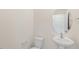 Simple yet elegant bathroom with pedestal sink and oval mirror at 1129 Middlecrest Dr, Rocky Mount, NC 27804