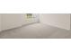 Spacious bedroom with carpeted floor and large window at 1129 Middlecrest Dr, Rocky Mount, NC 27804