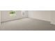 Bright bedroom featuring carpeted floor and dual windows at 1129 Middlecrest Dr, Rocky Mount, NC 27804