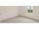 Well-lit bedroom featuring neutral walls and carpet at 1129 Middlecrest Dr, Rocky Mount, NC 27804