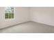 Bright bedroom with neutral carpeting and large window at 1129 Middlecrest Dr, Rocky Mount, NC 27804