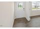 Light and airy entryway with wood-look floors and a glass-paneled door at 1129 Middlecrest Dr, Rocky Mount, NC 27804