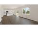 Spacious living room with wood-look floors and access to back deck at 1129 Middlecrest Dr, Rocky Mount, NC 27804