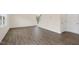 Bright and airy living room with wood-look floors and access to the stairs at 1129 Middlecrest Dr, Rocky Mount, NC 27804