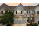 Well-lit townhome exterior at dusk showcasing architectural details and landscaping at 1145 Epiphany Rd, Morrisville, NC 27560