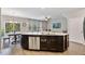 Modern kitchen island with stainless steel appliances and white countertops at 1145 Epiphany Rd, Morrisville, NC 27560