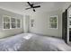 Spacious bedroom with neutral walls and multiple windows at 1147 Henderson Tanyard Rd, Pittsboro, NC 27312