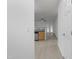 Hallway view of kitchen and living room with wood-look floors at 1204 Chamberwell Ave, Wake Forest, NC 27587