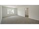 Spacious bedroom with carpeted floor and large window at 1230 Middlecrest Dr, Rocky Mount, NC 27804