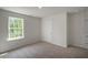 Bright bedroom with window and carpet flooring at 1230 Middlecrest Dr, Rocky Mount, NC 27804
