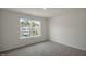 Bright bedroom with carpeted floor and large window at 1230 Middlecrest Dr, Rocky Mount, NC 27804