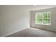 Spacious bedroom with large window and carpet at 1230 Middlecrest Dr, Rocky Mount, NC 27804