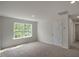 Well-lit bedroom with large window and carpet at 1230 Middlecrest Dr, Rocky Mount, NC 27804