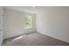 Bright bedroom featuring a window and carpet at 1230 Middlecrest Dr, Rocky Mount, NC 27804