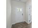 Bright entryway with wood-look floors and white door at 1230 Middlecrest Dr, Rocky Mount, NC 27804
