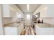 Renovated galley kitchen, featuring granite counters and white cabinets at 1313 First Pointe, Sanford, NC 27332