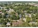 Aerial view showcasing a house's location in a residential area at 132 Woodburn Rd, Raleigh, NC 27605