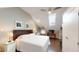 Main bedroom with king-size bed and skylight at 132 Woodburn Rd, Raleigh, NC 27605