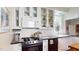 Bright kitchen features white cabinets, gas range and updated countertops at 132 Woodburn Rd, Raleigh, NC 27605