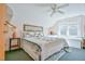 Bright bedroom with a queen bed, ceiling fan and window seat at 144G Celebrity Dairy Way, Siler City, NC 27344