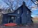 Dark gray house exterior with a large yard at 144G Celebrity Dairy Way, Siler City, NC 27344