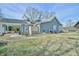 Gray house exterior with covered patio and spacious backyard at 144G Celebrity Dairy Way, Siler City, NC 27344