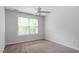 Bright bedroom with neutral walls and carpet at 1635 Shepherds Glade Dr, Apex, NC 27523