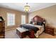 King-size bed, large windows and neutral decor highlight this calm bedroom at 193 N Grande Overlook Dr, Clayton, NC 27527