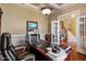 Home office with hardwood floors and built-in bookcases at 193 N Grande Overlook Dr, Clayton, NC 27527